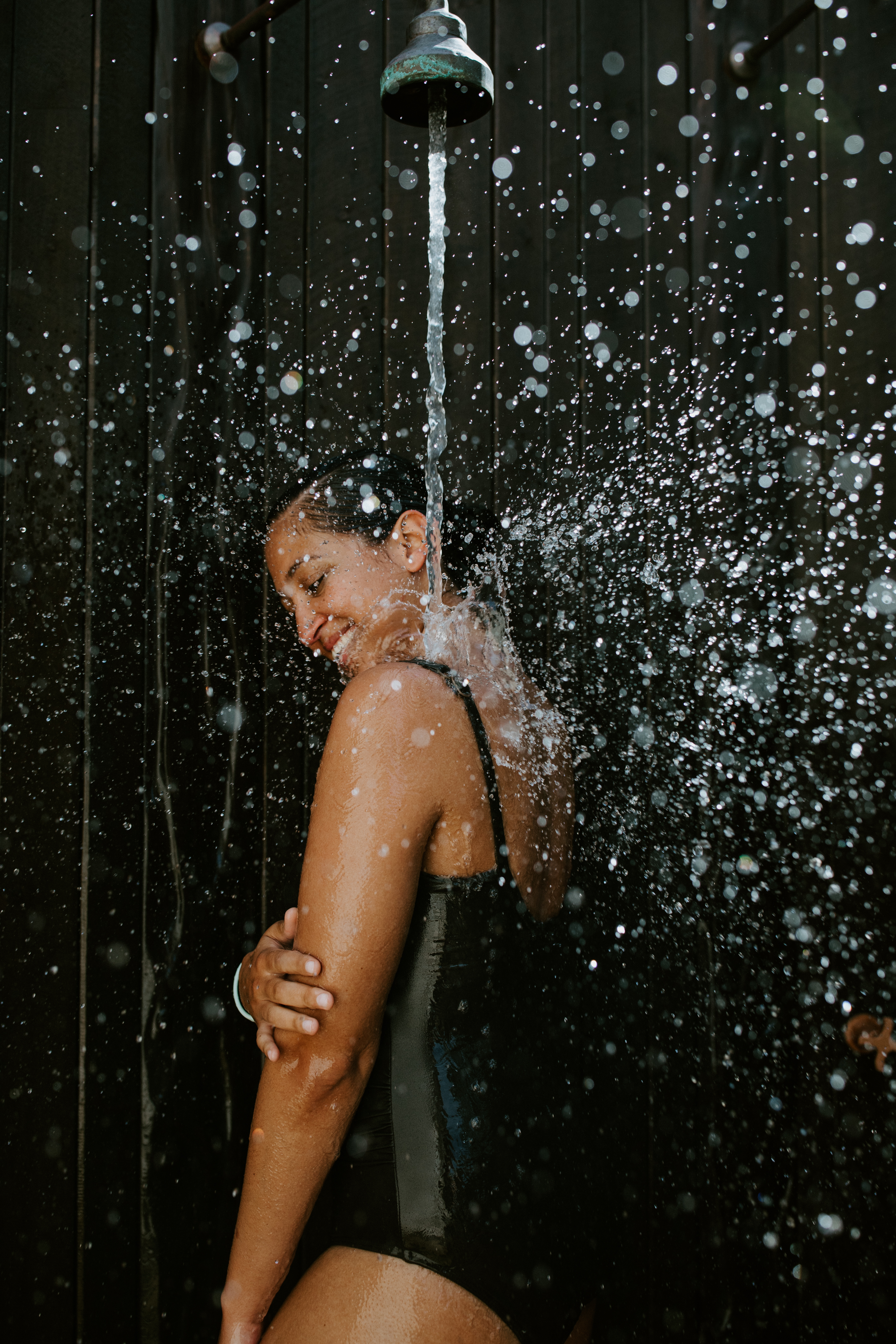 bath-house-amphitheatre-mineral-showers-girl-enjoying-the-massaging-showers-2.jpg